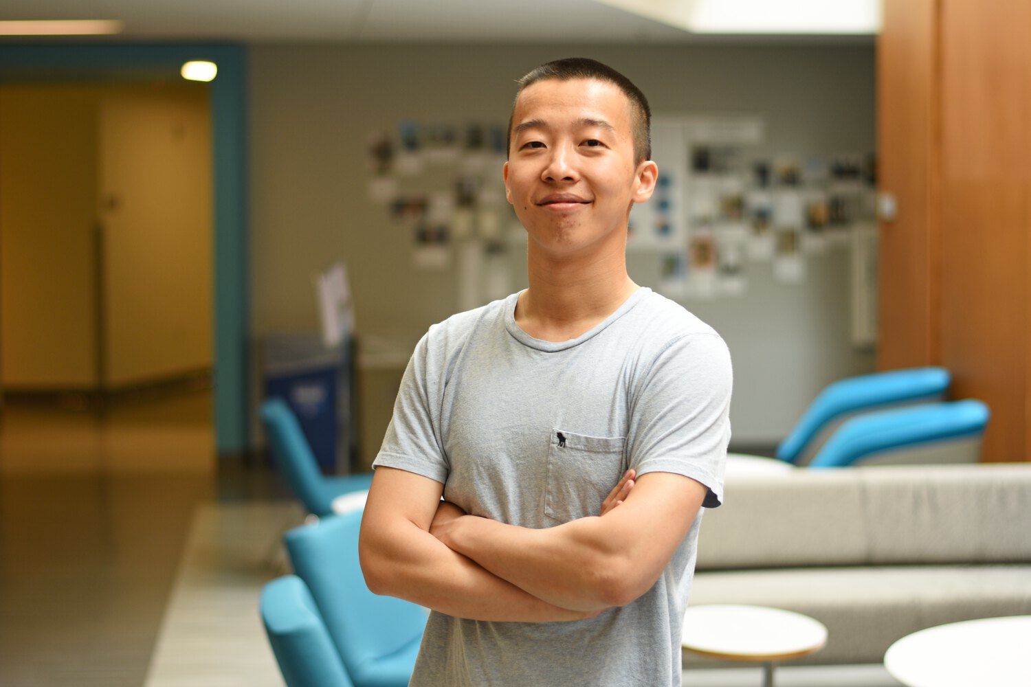 Boming Zhang standing with arms crossed